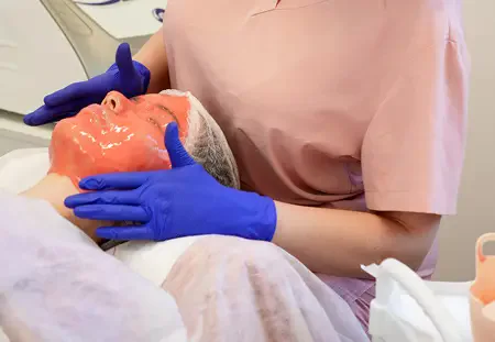 Professional facial mask applied during a Mirra Bella European facial